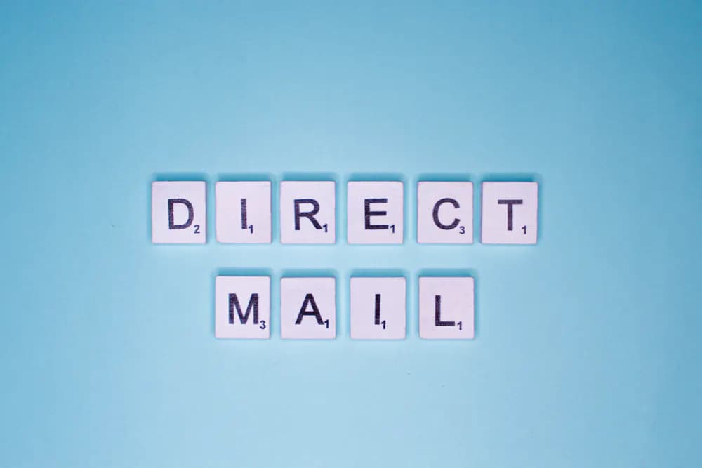 Letter tiles spelling out direct mail